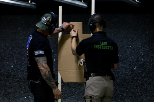 Checking targets during a private shooting lesson